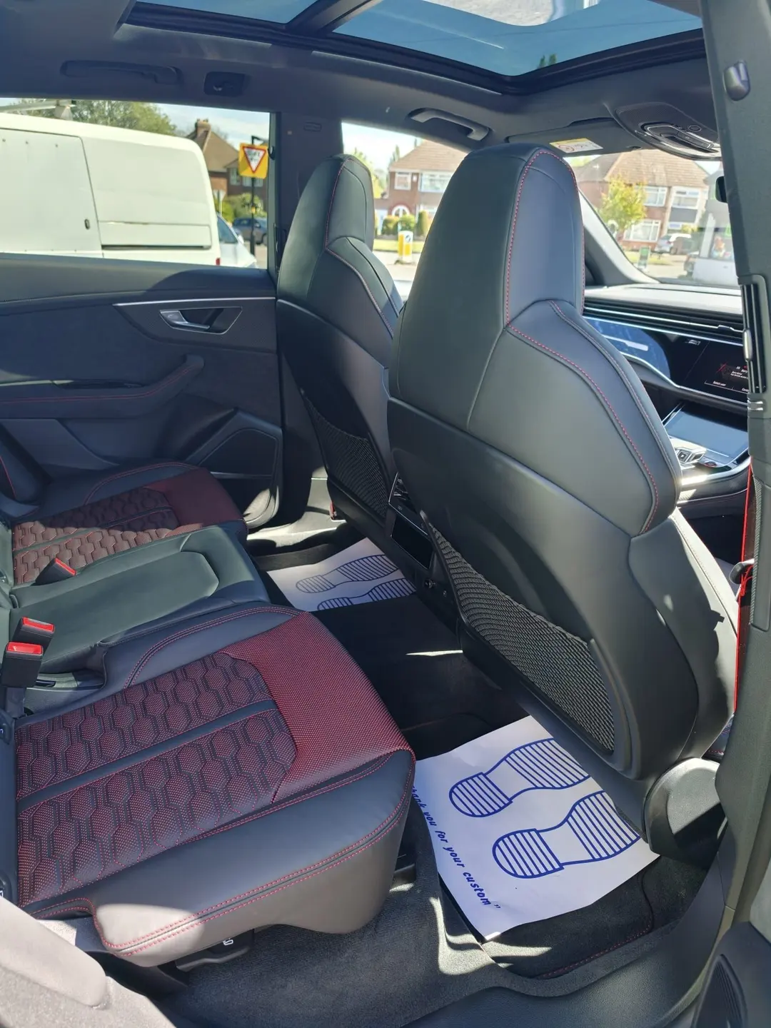 Audi RS quilted leather rear seats with a protective paper mat on the floor
