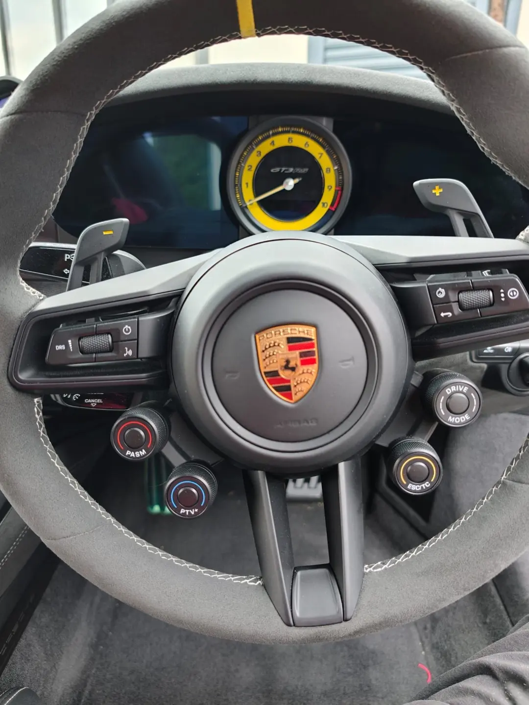 Porsche steering wheel and yellow-faced rev counter