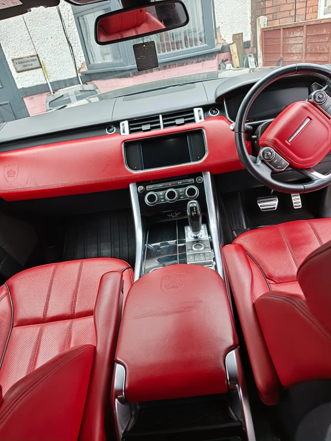 Range Rover interior with red leather seats and dashboard